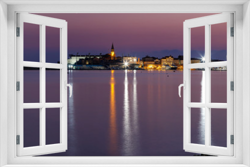 Night view of Budva old town and harbour, Montenegro. City skyline.