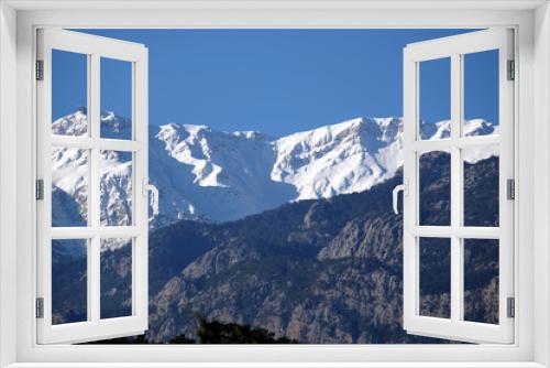 Fototapeta Naklejka Na Ścianę Okno 3D - Landscape with Turkish mountains of different heights, mountain pines on the slopes and snow on high peaks at far