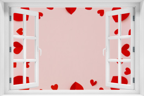 Frame of red heart on pink backgrond with copyspace for valentine greeting card.