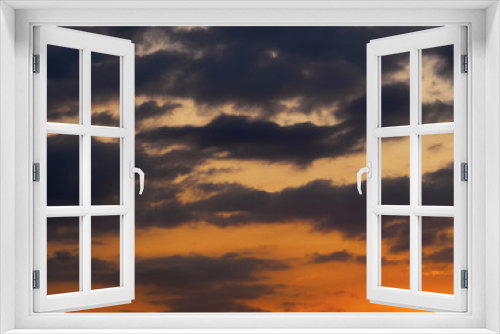 Fototapeta Naklejka Na Ścianę Okno 3D - Dark gray clouds on a red sunset sky