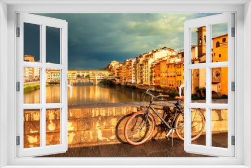 Fototapeta Naklejka Na Ścianę Okno 3D - View of medieval stone bridge Ponte Vecchio over Arno river and vintage bicycle in Florence, Tuscany, Italy. Florence cityscape. Florence architecture and landmark.