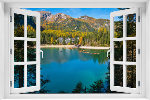 Fototapeta Naklejka Na Ścianę Okno 3D - Autumn peaceful alpine lake Braies or Pragser Wildsee. Dolomites Alps, Italy, Europe. People unrecognizuble.