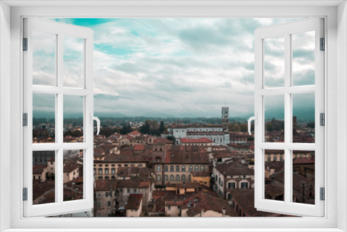 Skyline high up view of the quiet Tuscantown of Lucca, Italy