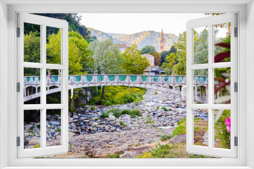 Fototapeta Naklejka Na Ścianę Okno 3D - Bridge over la Volane river in Vals-les-Bains, a spa town in the Ardèche departement in southern France a day of summer