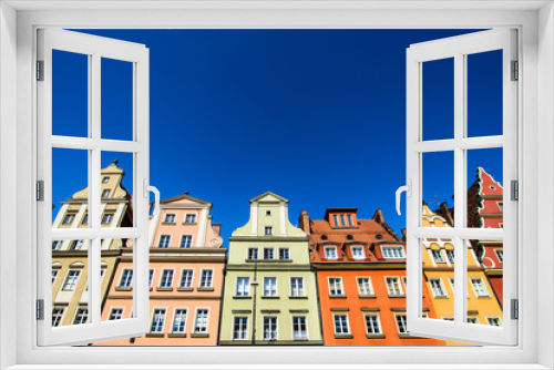 Fototapeta Naklejka Na Ścianę Okno 3D - Colourful houses, blue sky, Solny square, Wroclaw, Poland. Copy space