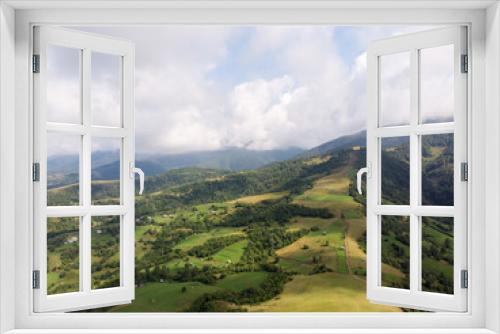 Fototapeta Naklejka Na Ścianę Okno 3D - Aerial photography of a mountainous countryside.