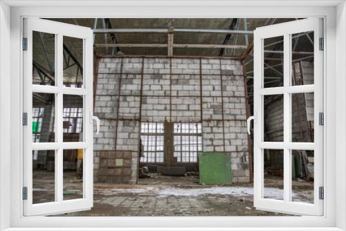 Fototapeta Naklejka Na Ścianę Okno 3D - Interior of an abandoned industrial workshop. MIG Aircraft Building Plant in Moscow, Russia