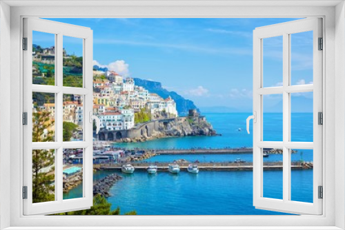 Fototapeta Naklejka Na Ścianę Okno 3D - Beautiful Amalfi with hotels on hills leading down to coast, comfortable beaches and azure sea in Campania, Italy.