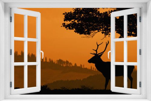 Fototapeta Naklejka Na Ścianę Okno 3D - Orange landscape with a silhouette of a deer. Hills covered with forest and the silhouette of a deer under the tree in the foreground