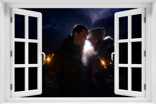 Fototapeta Naklejka Na Ścianę Okno 3D - Loving couple silhouette. Back light and snow.