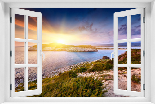 Fototapeta Naklejka Na Ścianę Okno 3D - Amazing sunset view with multicolored clouds. Incredibly romantic sunrise on Voidokilia beach, Ionian Sea, Pilos town location, Greece, Europe. View of the ocean through the rocky shore