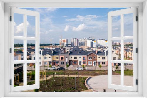Fototapeta Naklejka Na Ścianę Okno 3D - House building cottage village and city construction concept: evening outdoor urban view of modern real estate homes