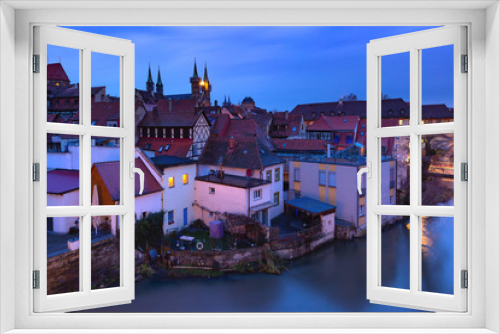 Fototapeta Naklejka Na Ścianę Okno 3D - Aerial panoramic view of Old town of Bamberg over the Regnitz river with Michelsberg monastery at night, Bavaria, Upper Franconia, Germany