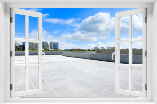 Fototapeta Naklejka Na Ścianę Okno 3D - Empty square floor and building under blue sky