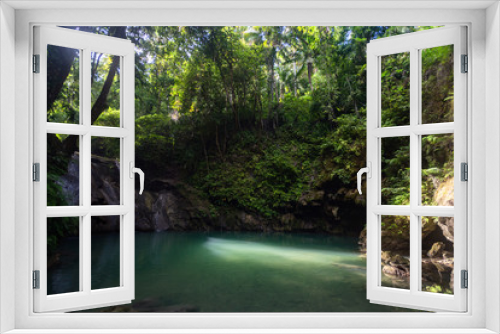 Fototapeta Naklejka Na Ścianę Okno 3D - Hidden in jungles Ingkumhan waterfalls, popular tourist attraction in Dimiao, Bohol, Philippines