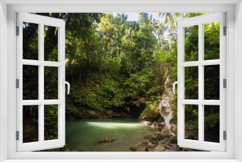 Fototapeta Naklejka Na Ścianę Okno 3D - Hidden in jungles Ingkumhan waterfalls, popular tourist attraction in Dimiao, Bohol, Philippines