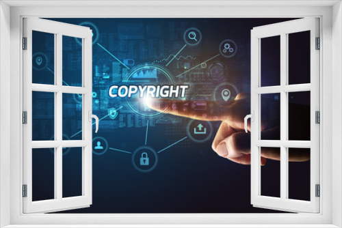 Hand touching COPYRIGHT inscription, Cybersecurity concept