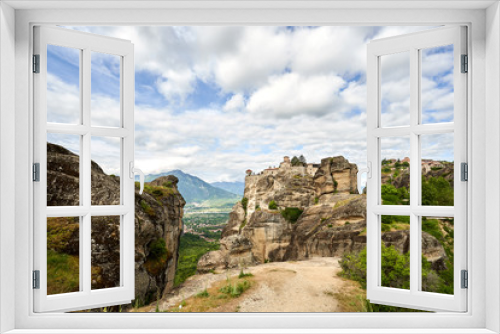 Fototapeta Naklejka Na Ścianę Okno 3D - Amazing Meteora Monastery in Greece. Fantastic view at mountains and green forest against epic blue sky with clouds. UNESCO