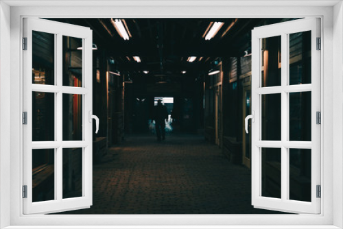 Fototapeta Naklejka Na Ścianę Okno 3D - person walking down dark hallway