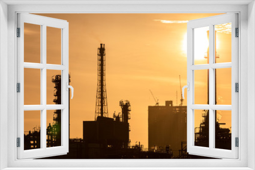 Fototapeta Naklejka Na Ścianę Okno 3D - Silhouette of oil and gas refinery industry plant with glitter lighting and sunrise in the morning, Factory of petroleum industrial, Power plant, Energy power station area.