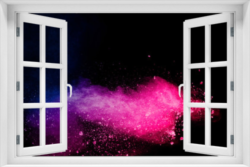 Fototapeta Naklejka Na Ścianę Okno 3D - Blue pink powder explode cloud on black background.Launched blue pink dust particles splash on background.