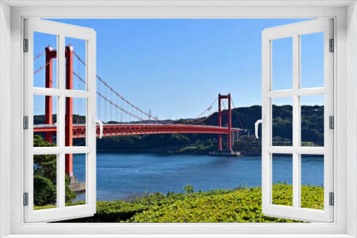 Fototapeta Naklejka Na Ścianę Okno 3D - 青空に映える赤い平戸大橋と紺碧の海のコラボ情景＠長崎