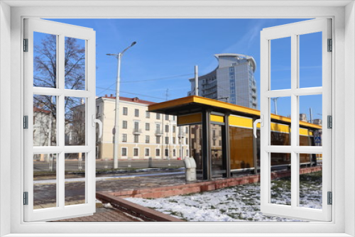Fototapeta Naklejka Na Ścianę Okno 3D - yellow bench at tramway station in city