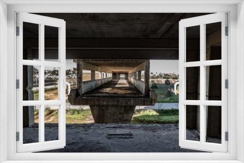 Fototapeta Naklejka Na Ścianę Okno 3D - ruin of an unfinished concrete skeleton building