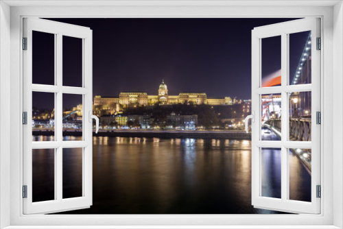 Fototapeta Naklejka Na Ścianę Okno 3D - Buda Castle, Royal Palace by the Danube river illuminated at night in Budapest