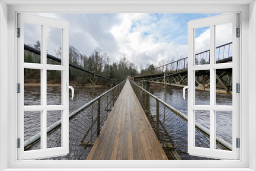 Fototapeta Naklejka Na Ścianę Okno 3D - Landscape with river and pedestrian bridge