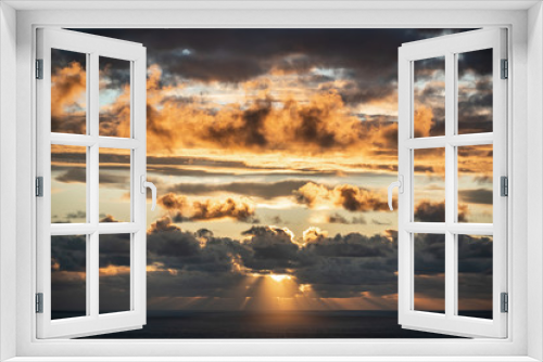 Fototapeta Naklejka Na Ścianę Okno 3D - Aerial view of beautiful clouds over horizon with sun rays before sunset