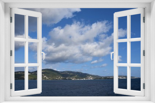 Fototapeta Naklejka Na Ścianę Okno 3D - Skiathos island , the most famous island of Greece is one of the most famous Greek destinations in the whole world, here we see a view of the island from a ship. Famous for its beaches, one of the bes