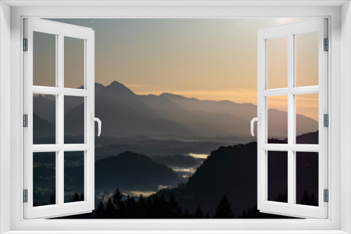 Fototapeta Naklejka Na Ścianę Okno 3D - View on the beautiful sunrise over the majestic hills with the Lake Bled in Slovenia