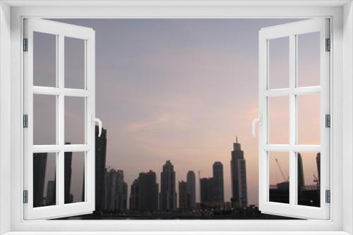 Fototapeta Naklejka Na Ścianę Okno 3D - Dubai skyline at sunset