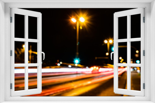 Fototapeta Naklejka Na Ścianę Okno 3D - Blurred city lights of an intersection at night