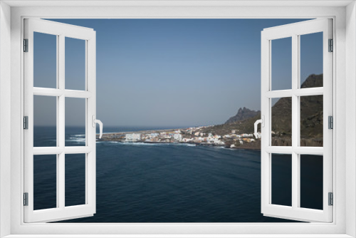 The coast of the ocean and mountains. Top view of the city of Punta del Hidalgo Canary Islands. Sunny day. Travel to the beautiful places of the planet Earth.