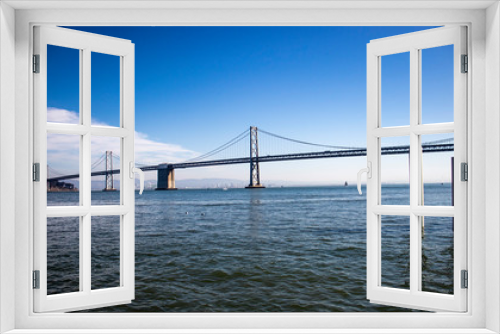 Fototapeta Naklejka Na Ścianę Okno 3D - Horizontal image of the metal bridge of San Francisco in California over the bay, summer blue sky, horizontal bridge