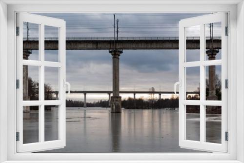 Fototapeta Naklejka Na Ścianę Okno 3D - View of the bridges across the Saimaa Canal on a cloudy spring day.