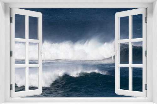 Fototapeta Naklejka Na Ścianę Okno 3D - Dramatic white surf and spray as blue ocean waves roll.Image