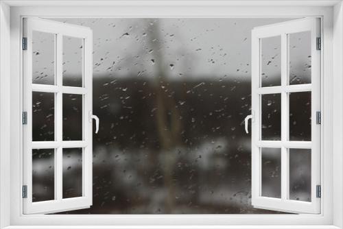 Fototapeta Naklejka Na Ścianę Okno 3D - raindrops on the window on a blurred background of inclement weather