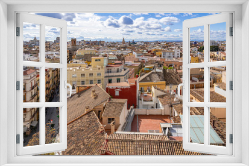 Fototapeta Naklejka Na Ścianę Okno 3D - Photo of the roofs of old buildings with roof terraces and the old town with its many church towers, taken from the Porta de Sarrans, Valencia, Spain