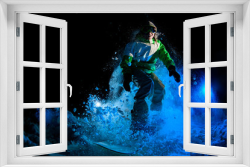 Fototapeta Naklejka Na Ścianę Okno 3D - Darkened shot of guy riding on snowboard