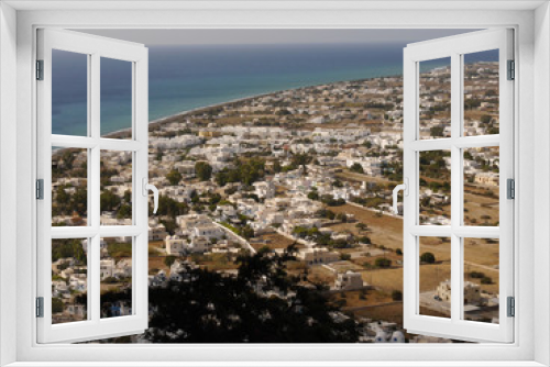 Fototapeta Naklejka Na Ścianę Okno 3D - Panoramic view of the village of Perissa on Santorini island, from the top of the mountain. Aerial view of the Mediterranean Sea and beaches.