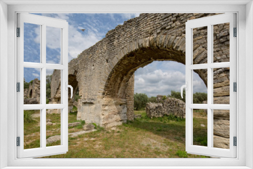 Fototapeta Naklejka Na Ścianę Okno 3D - The Historical Monument Aqueduct Romain de Barbegal. The Barbegal aqueduct and mills constitute a Roman complex of hydraulic milling located in Fontvieille, near the town of Arles, Provence, France