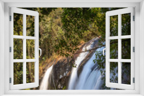 Fototapeta Naklejka Na Ścianę Okno 3D - Waterfall in the middle of the Atlantic forest on a sunny day and very green.