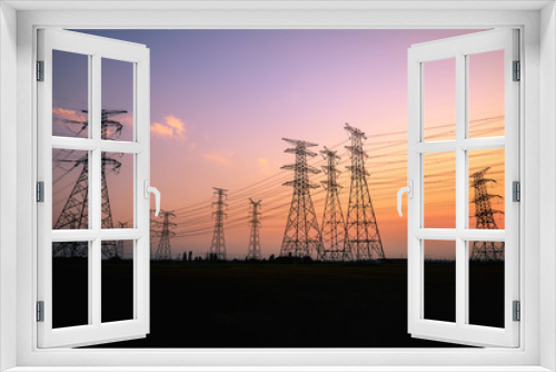 Fototapeta Naklejka Na Ścianę Okno 3D - High voltage power tower and beautiful nature landscape at sunset