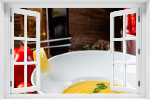 Fototapeta Naklejka Na Ścianę Okno 3D - Serbian cuisine. Macedonian cream soup of chickpeas, carrots, onions, garlic, with chicken. Serving dishes in a restaurant in a white plate. background image, copy space text