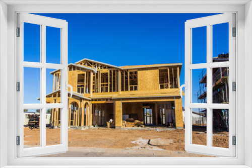 Fototapeta Naklejka Na Ścianę Okno 3D - Brand New Two Story Home Under Construction