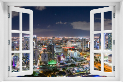 Fototapeta Naklejka Na Ścianę Okno 3D - Amazing aerial panorama of Downtown Miami FL USA at night with bright city lights