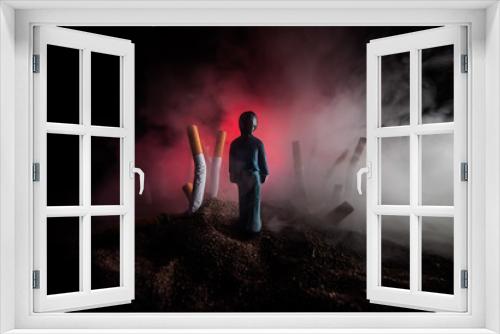 Fototapeta Naklejka Na Ścianę Okno 3D - Ashtray and butts cigarettes on dark background. Selective focus